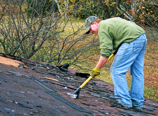 Contractor Removing Shingles